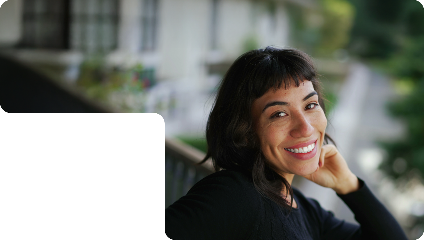 Close up of woman with black hair smiling